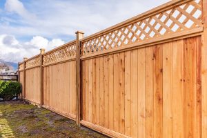 A wooden fence installed in a backyard
